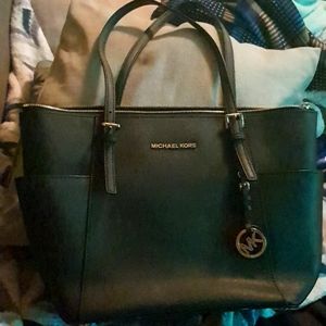 Michael kor's women's black voyager tot bag.